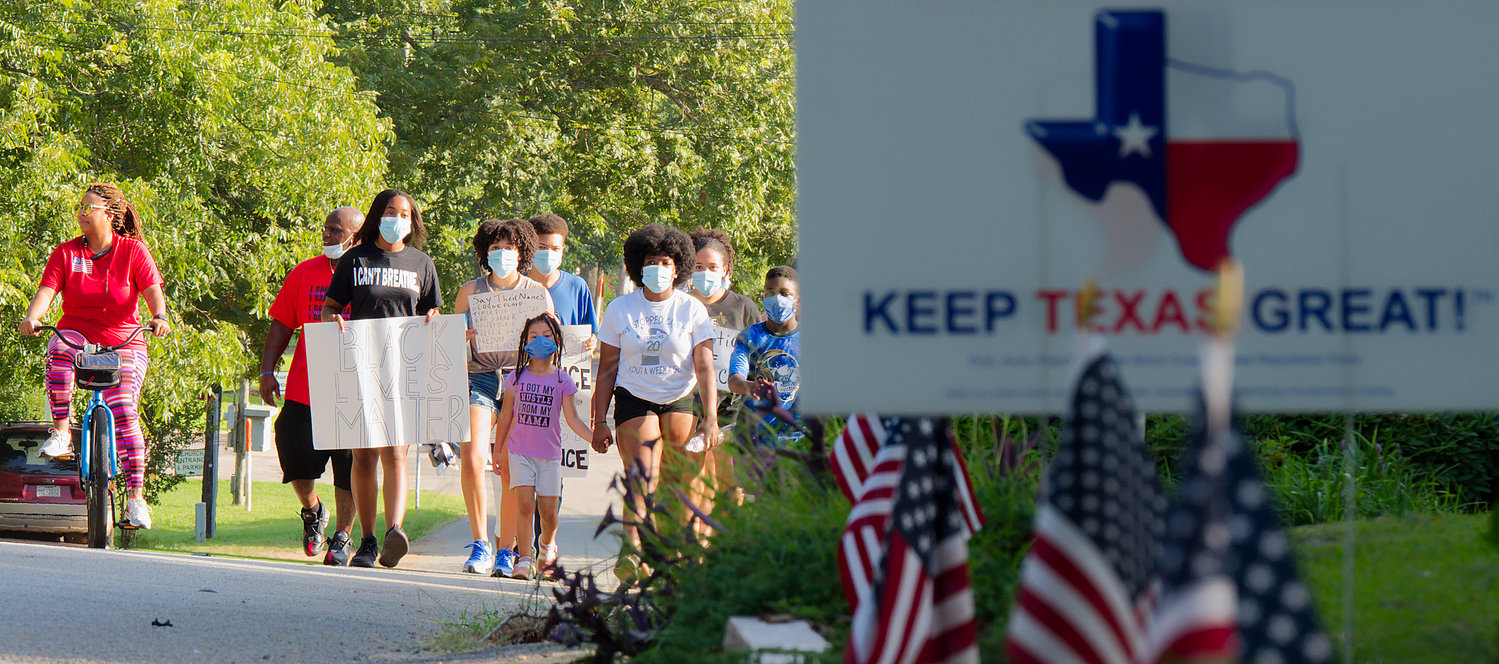 The social justice movement made its way peacefully to Wood County. Protest marchers followed medical recommendations by wearing masks while political and patriotic signs marked some of the route. [you may buy this photo]
